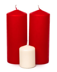 Red and white colored xmas candles isolated on white background