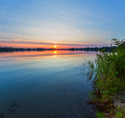 Summer sunset lake calm view.