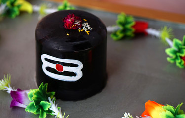 Hindu People offer prayers or do puja to linga shape considered as God Shva, on Maha shiva ratri,a...
