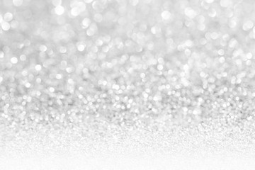 Blurred shiny white glitter bokeh abstract background