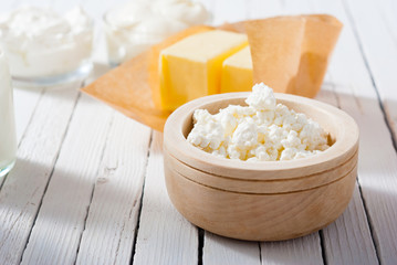 homemade dairy product samples on white wood table background