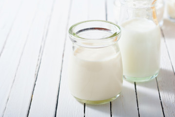 milk samples on white wood table