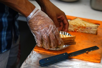 Closeup view of chef making Indian street food Bread sandwich