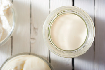 goat milk on white wooden table