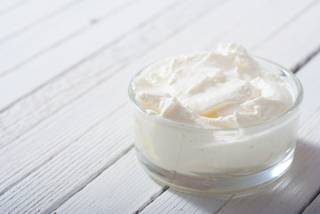 yogurt on white wooden table background