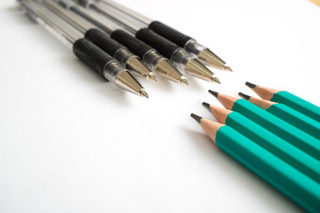 pens black in front of them are graphite pencils green