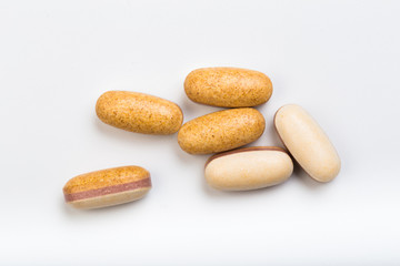 set of yellow tablets  on a white background