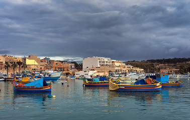 Fototapeta na wymiar Fisher town after storm. Marsaxlokk, Malta