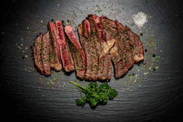 Grilled flat iron steak shot in flat lay style