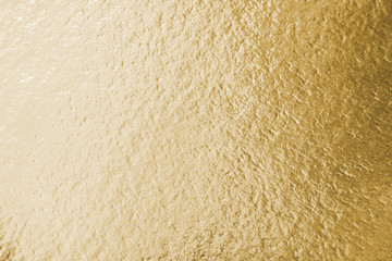 Gold foil leaf shiny wrapping paper texture background for wall paper decoration element