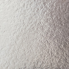 Rose gold pink purple color shiny paper foil leaf texture background with bright brilliant reflective glossy metallic material surface.