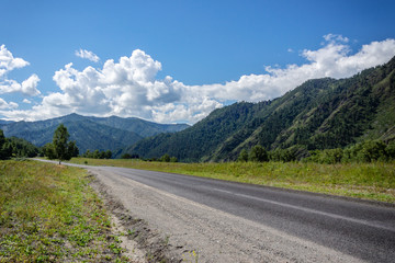 Fototapeta na wymiar road among the mountains in summer