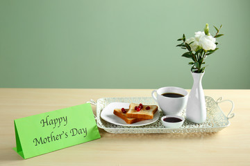 Greeting card with tasty breakfast for mother on wooden table