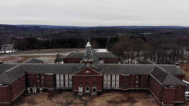 Drone Shot Flying Passed A Large Decaying Cupola At The Abandoned Fairfield Hills Hospital Asylum In Newtown, Connecticut.