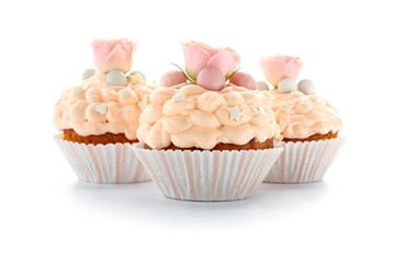 Tasty Easter cupcakes on white background