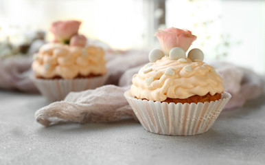 Tasty Easter cupcake on grey table