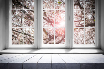 Obraz premium Desk of free space and spring window background 