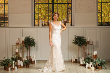 Fototapeta premium Beautiful blonde model posing in luxury wedding dress
