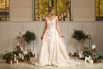 Obraz premium Beautiful blonde model posing in luxury wedding dress