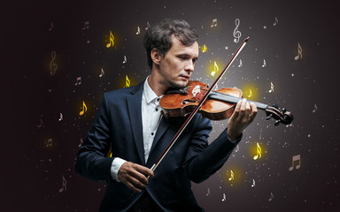 Fototapeta premium Young violinist with falling musical notes wallpaper and classical concept