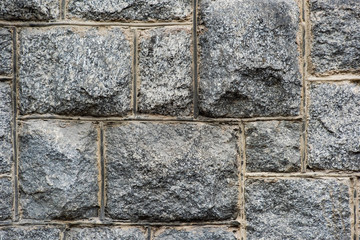 Uneven stone block wall