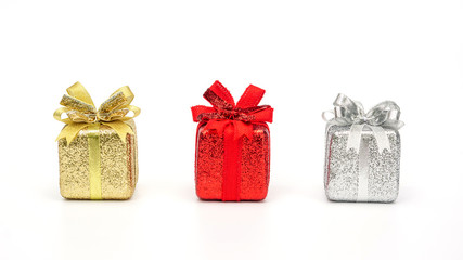 Gold, red, and silver gift box on a white background.