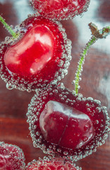 delicious cherries in sprkling water, refreshing fruits concept.