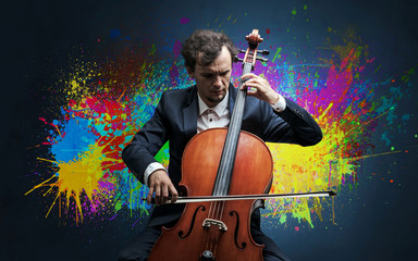 Fototapeta premium Young classical musician with colorful splotch wallpaper 