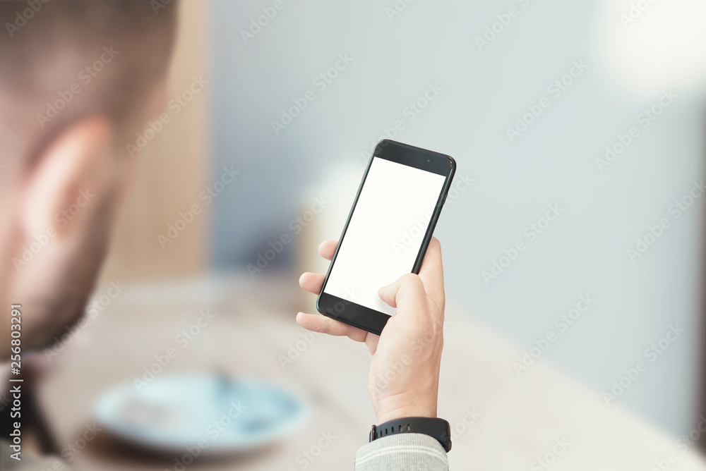 Leinwandbilder mockup image of modern smart phone in guy hand. user interface design promotion.