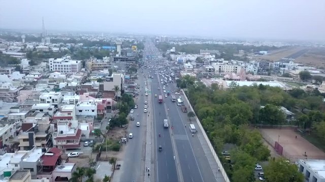 Aerial Timelapse of city highway, rainy weather, filmed in India in 4K.