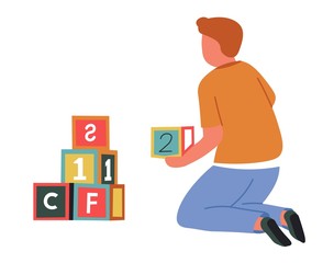 Boy and abc cubes child playing games with toys