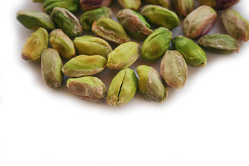 Shelled pistachios isolated on white background in selective focus