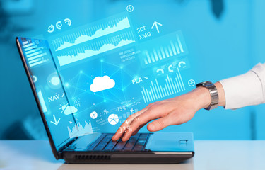Hand using laptop with cloud technology and linked information concept