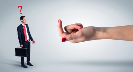 Businessman in an affair with kisses on his face and question concept
