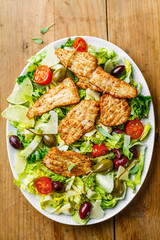 Chicken salad with vegetables and olives