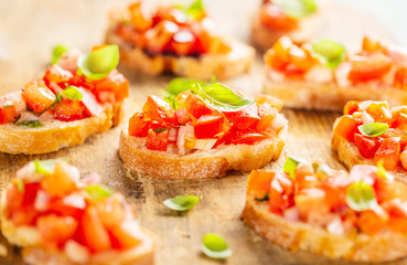 Classic italian bruschetta served on wooden board