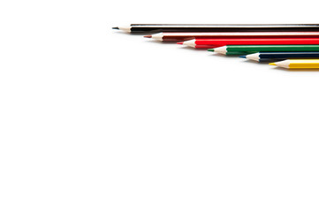 Colored pencils on white background. Several different pencils.