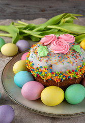Easter cake, painted eggs on a wooden background.