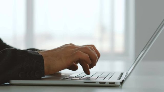 Business communication and email correspondence. Man hands typing on laptop.