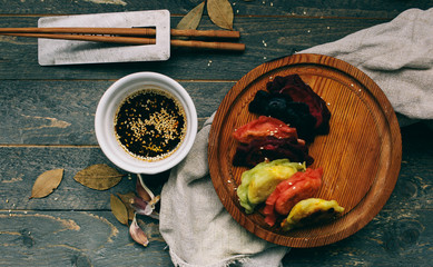 Asian dumplings with soy sauce Sesame seeds and Plate of Japanese gyoza Traditional chinese dim sum...