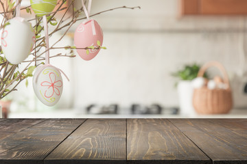 Easter. Blurred kitchen and wooden tabletop with space for display your product.