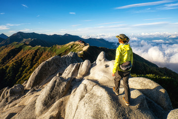 Epic adventure of hiker do trekking activity in mountain of Northern Japan Alps, Nagano, Japan,...