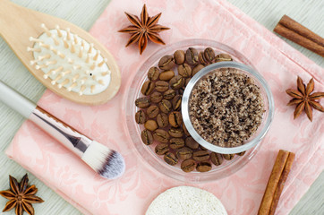 Fototapeta na wymiar Homemade spicy aroma scrub with brown sugar, ground coffee, olive oil, cinnamon and star anise powder. DIY beauty treatments and spa recipe. Top view, copy space
