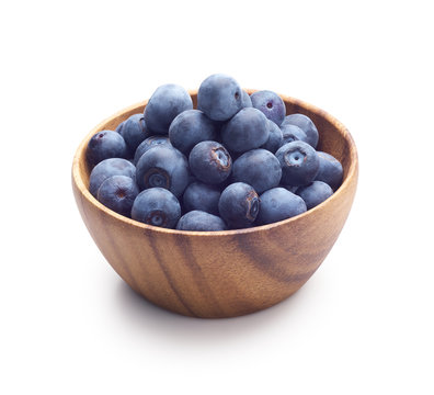 Wooden bowl filled with blueberry