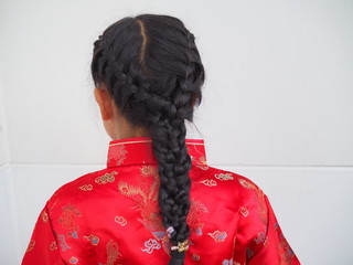 Chinese girl with her braid hair from back side
