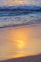 Calm ocean waves on the sand beach. Bali.