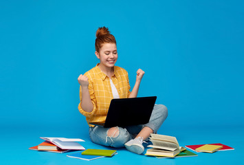 education, high school and technology concept - happy red haired teenage student girl in checkered...
