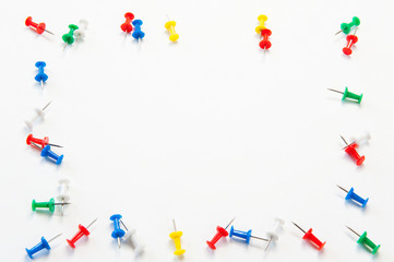 Stationery on white background. Multi-colored buttons of paper.