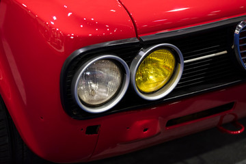 Fototapeta na wymiar A close up of a classic vintage car headlight
