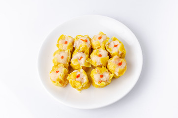 Chinese steamed shrimp dumplings on white dish